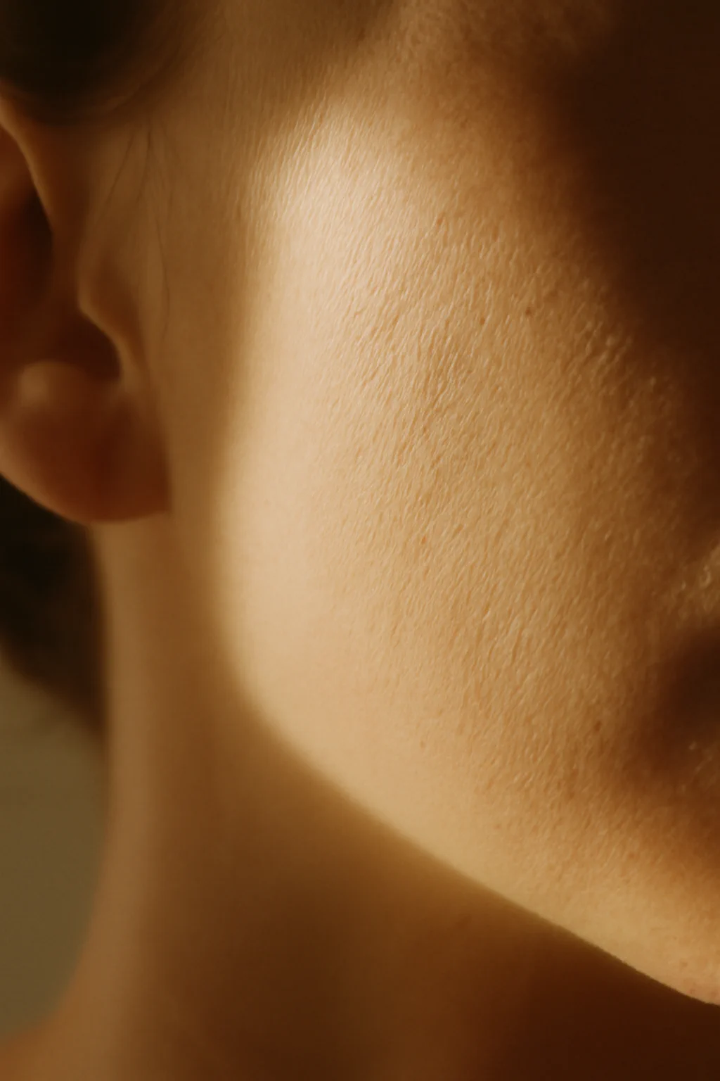 Editorial macro of dry tight skin along a jawline